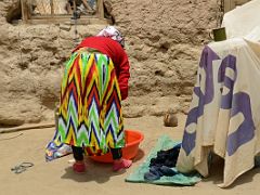 18 Woman Washing Clothes In Yilik Village On The Way To K2 China Trek